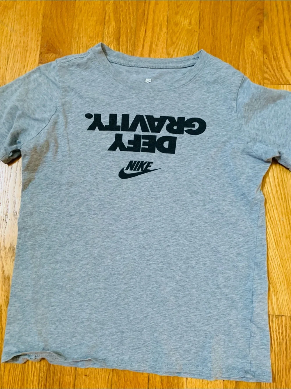 2 Nike Boys L Shirts : Defy Gravity' Nike tee and a green Milltown United jersey